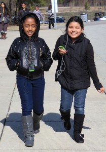 Two girls walking with The Walking Classroom